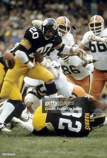 S: Running back Rocky Bleier of the Pittsburgh Steelers has the ball knocked out of his arms by linebacker Charlie Hall of the Cleveland Browns circa...