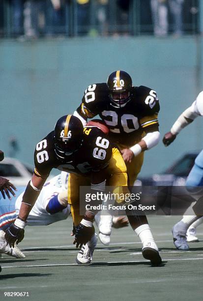 S: Running back Rocky Bleier of the Pittsburgh Steelers in action carries the ball led by guard Ted Petersen against the Houston Oilers circa late...