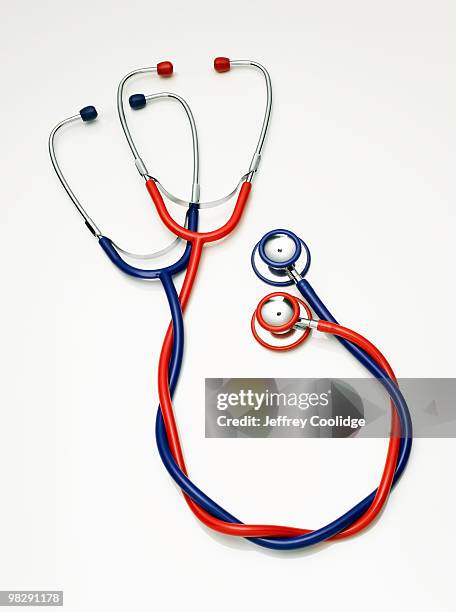 two stethoscopes entwined  - jeffrey coolidge stock-fotos und bilder