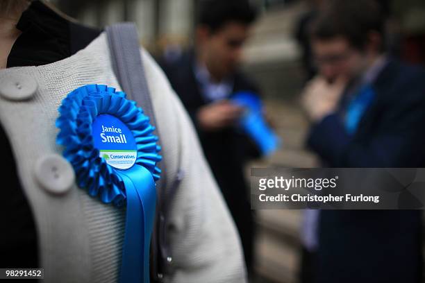 Supporters of prospective parlimentary candidate Janice Small wear rosettes as they wait for party leader David Cameron to speak at Leeds City Museum...