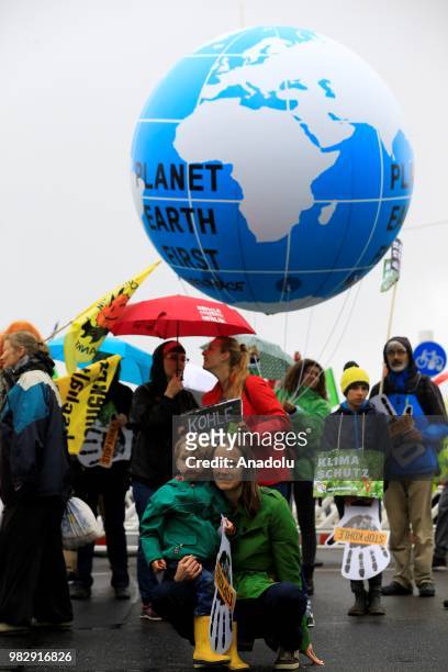 Demonstrators gather to protest against coal-based energy in front of the Chancellery in the 'Stop Coal' protest event on June 24, 2018 in Berlin,...