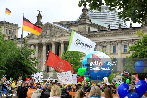 Demonstrators gather to protest against coal-based energy in front of the Chancellery in the 'Stop Coal' protest event on June 24, 2018 in Berlin,...