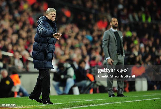 Manager of Arsenal Arsene Wenger and manager of Barcelona Josep Guardiola react on the touchline during the UEFA Champions League quarter final...