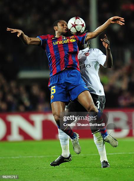 Seydou Keita of Barcelona is challenged by Bacary Sagna of Arsenal during the UEFA Champions League quarter final second leg match between Barcelona...