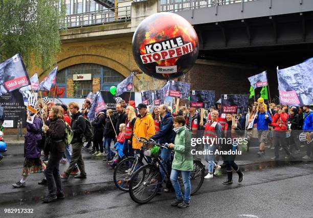 Demonstrators gather to protest against coal-based energy in front of the Chancellery in the 'Stop Coal' protest event on June 24, 2018 in Berlin,...