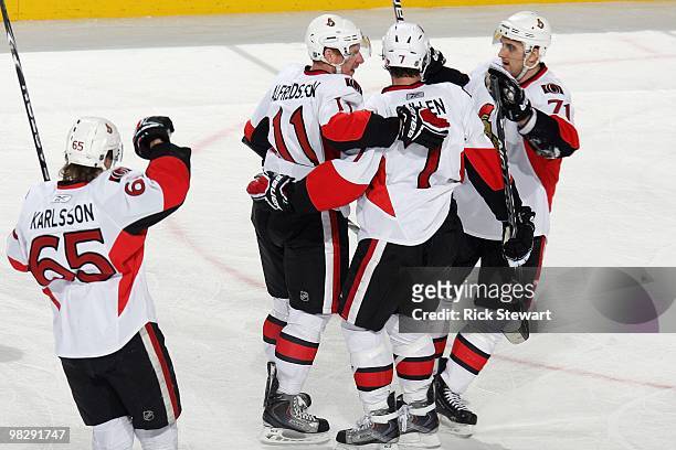 Erik Karlsson, Daniel Alfredsson, Matt Cullen and Nick Foligno of the Ottawa Senators celebrate during the game against the Buffalo Sabres at HSBC...