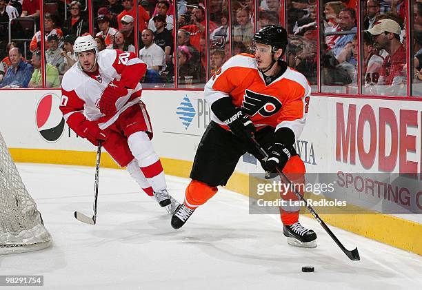 Lukas Krajicek of the Philadelphia Flyers skate the from behind his net against Drew Miller of the Detroit Red Wings on April 4, 2010 at the Wachovia...