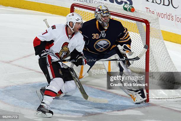 Matt Cullen of the Ottawa Senators skates against Ryan Miller of the Buffalo Sabres at HSBC Arena on March 26, 2010 in Buffalo, New York.