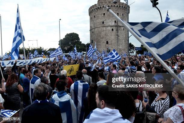 People wave Greek flags as they demonstrate against the agreement between Greece and Macedonia for the new name, in Thessaloniki on June 24, 2018. -...