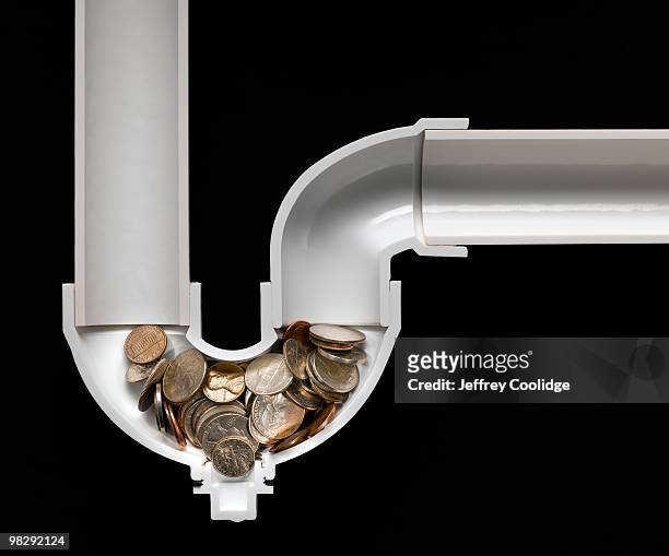 us coins stuck in drain pipe - jeffrey coolidge stock-fotos und bilder