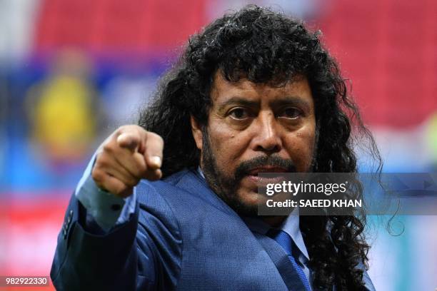 Former Colombian football legend Rene Higuita gestures before the Russia 2018 World Cup Group H football match between Poland and Colombia at the...