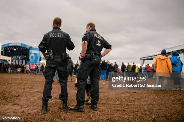 Two police officers patrol during the third day of the Hurricane festival on June 24, 2018 in Scheessel, Germany.