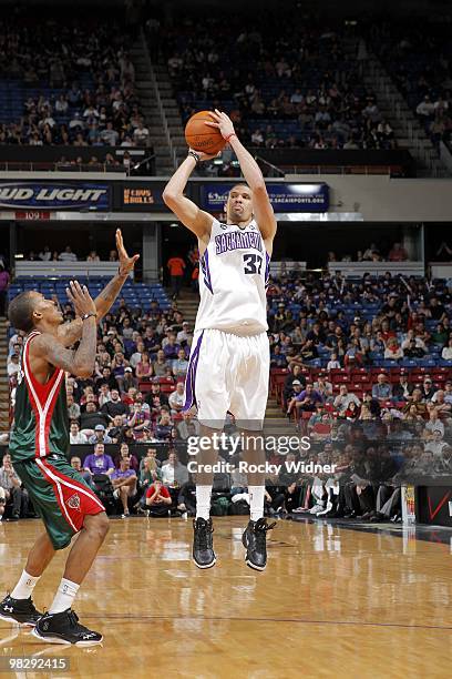 Francisco Garcia of the Sacramento Kings shoots a jump shot against Brandon Jennings of the Milwaukee Bucks during the game at Arco Arena on March...