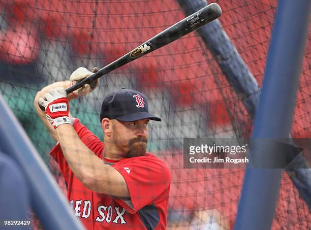 Kevin Youkilis of the Boston Red Sox prepares for batting practice before a game against the New York Yankees at Fenway Park on April 6, 2010 in...