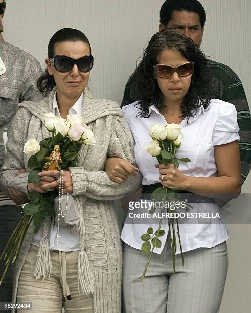 Lissette Farah , the mother of Paulette Gebara, walks during her daughter's funeral at the France Cemetery, in Mexico City, on April 6, 2010....