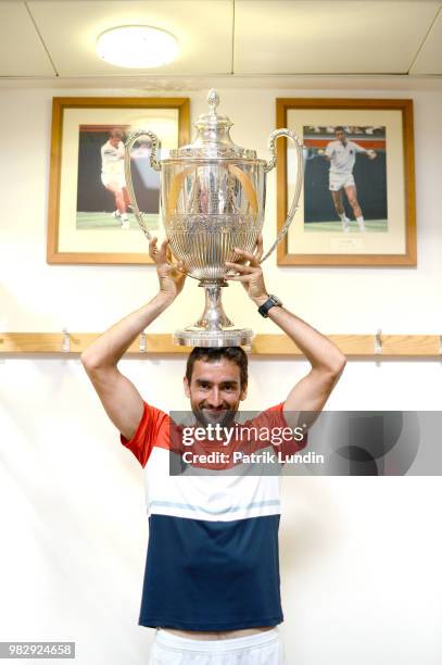 Marin Cilic of Croatia with the trophy after victory in the final match against Novak Djokovic of Serbia during Day seven of the Fever-Tree...