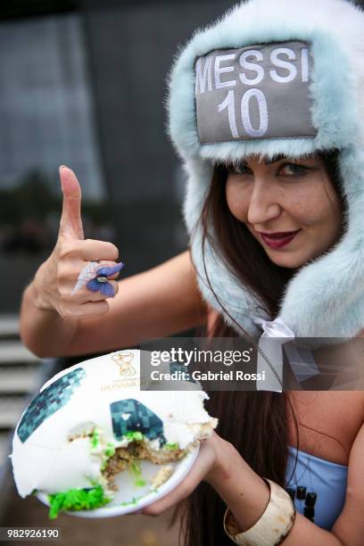 Fan gives a thumb up during a celebration made by fans and local villagers of Bronnitsy who gather to commemorate Lionel Messi's 31st birthday at a...