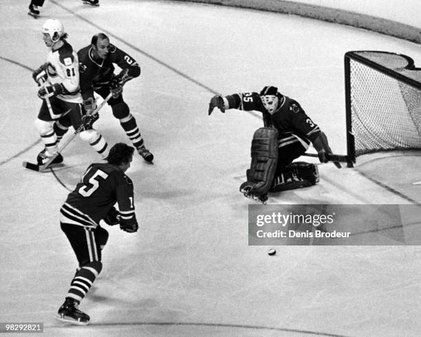 Bill White of the Chicago Blackhawks skates against the Montreal Canadiens in the 1970's at the Montreal Forum in Montreal, Quebec, Canada.