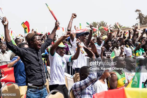 Senegal fans watch game two of group H between Japan and Senegal at Obelisque square on June 24, 2018 in Dakar, Senegal. The game finished 2-2...