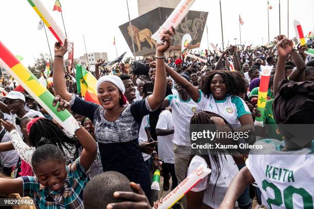 Senegal fans watch game two of group H of the World Cup match between Japan and Senegal at Obelisque square on June 24, 2018 in Dakar, Senegal. The...