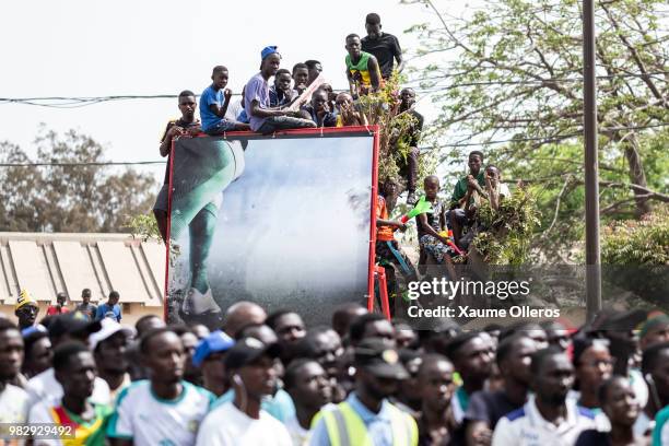 Senegal fans watch game two of group H of the World Cup match between Japan and Senegal at Obelisque square on June 24, 2018 in Dakar, Senegal. The...