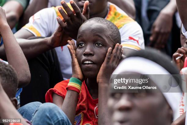 Senegal fans watch game two of group H of the World Cup match between Japan and Senegal at Obelisque square on June 24, 2018 in Dakar, Senegal. The...