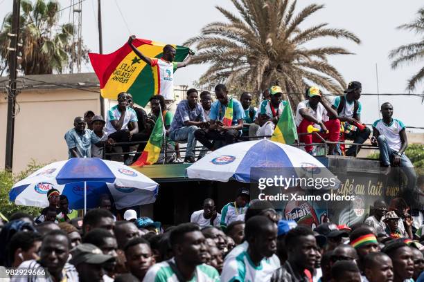 Senegal fans watch game two of group H of the World Cup match between Japan and Senegal at Obelisque square on June 24, 2018 in Dakar, Senegal. The...