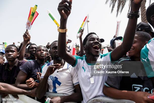 Senegal fans watch game two of group H of the World Cup match between Japan and Senegal at Obelisque square on June 24, 2018 in Dakar, Senegal. The...