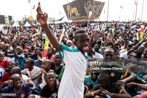 Senegal fans watch game two of group H between Japan and Snegegal at Obelisque square on June 24, 2018 in Dakar, Senegal. . The game finished 2-2...
