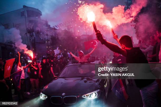 People react outside the Justice and Development Party headquarters in Istanbul, on June 24 during the Turkish presidential and parliamentary...
