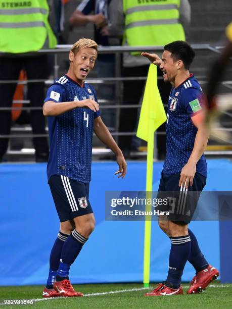 Keisuke Honda of Japan celebrates scoring his side's second goal during the 2018 FIFA World Cup Russia group H match between Japan and Senegal at...