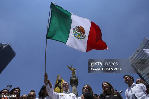 Mexico's presidential candidate Ricardo Anaya , standing for the "Mexico al Frente" coalition of the PAN-PRD-Movimiento Ciudadano parties, waves a...