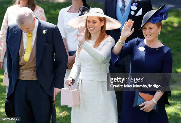Prince Andrew, Duke of York bows his head whilst Princess Beatrice and Sarah, Duchess of York wave to Queen Elizabeth II as she and her guests pass...