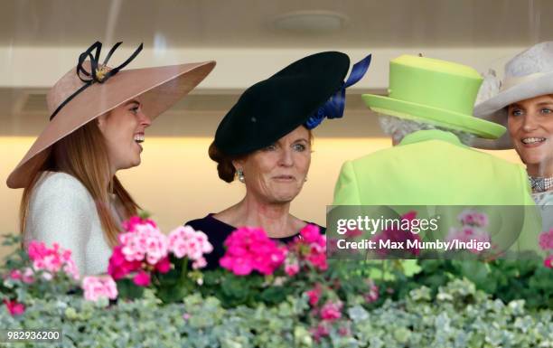 Princess Beatrice and Sarah, Duchess of York seen talking with Queen Elizabeth II in the Royal Box before watching The Queen's horse 'Elector' run in...