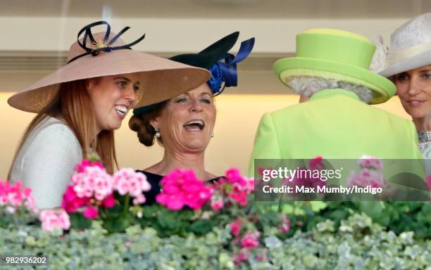 Princess Beatrice and Sarah, Duchess of York seen talking with Queen Elizabeth II in the Royal Box before watching The Queen's horse 'Elector' run in...