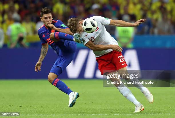 Lukasz Piszczek of Poland is challenged by Juan Quintero of Colombia during the 2018 FIFA World Cup Russia group H match between Poland and Colombia...