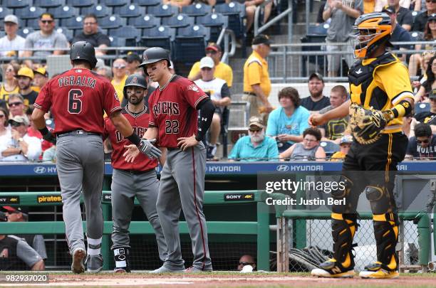 David Peralta of the Arizona Diamondbacks is greeted at home plate by Jake Lamb after hitting a two run home run in the first inning during the game...