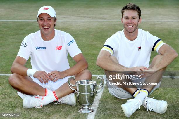 Henri Kontinen of Finland and John Peers of Australia pose foro photographers after the men's doubles final match against Jamie Murray of Great...