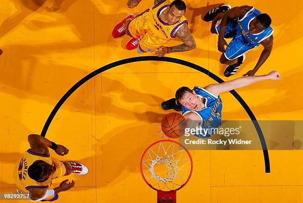 Darius Songaila of the New Orleans Hornets reaches for a rebound against the Golden State Warriors on March 17, 2009 at Oracle Arena in Oakland,...