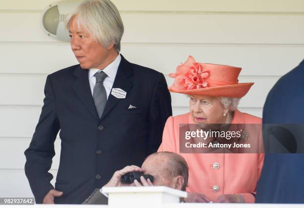 David M. Matsumoto with HM Queen Elizabeth II attend The OUT-SOURCING Inc Royal Windsor Cup 2018 polo match at Guards Polo Club on June 24, 2018 in...