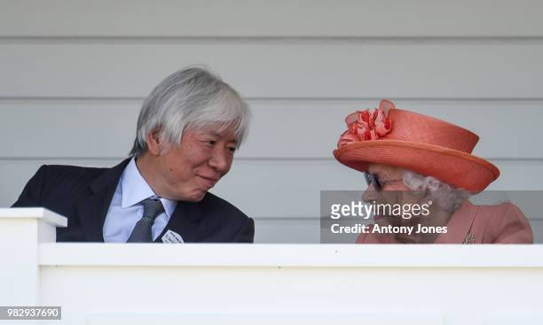 David M. Matsumoto with HM Queen Elizabeth II attend The OUT-SOURCING Inc Royal Windsor Cup 2018 polo match at Guards Polo Club on June 24, 2018 in...