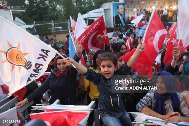 Party supporters wave flags in front of the AKP headquarters in Ankara on June 24, 2018. - Turkish President was on June 24, 2018 leading a...