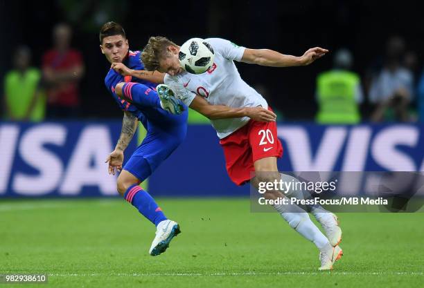 Juan Quintero of Colombia competes with Lukasz Piszczek of Poland during the 2018 FIFA World Cup Russia group H match between Poland and Colombia at...