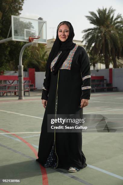 Lina Khaled Al-Maeena, a member of the 180-member Shura Council that advises Saudi King Salman bin Abdulaziz, poses for a photo as she stands on the...