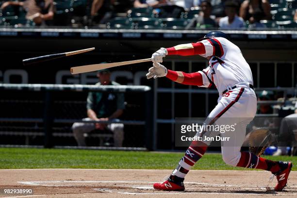 Avisail Garcia of the Chicago White Sox breaks his bat as he flies out against the Oakland Athletics during the first inning at Guaranteed Rate Field...