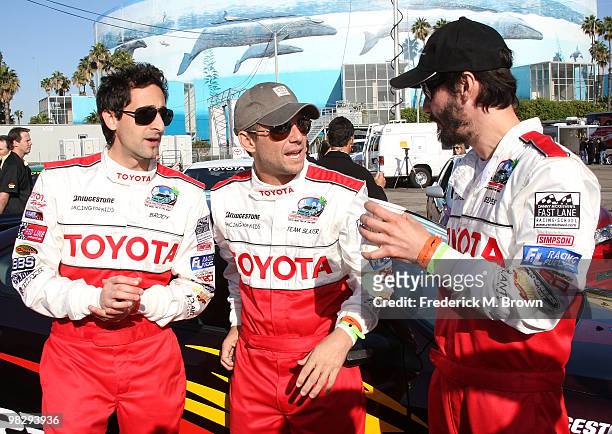 Actors Adrien Brody, Christian Slater and Keanu Reeves pose for photographers during the press practice day for the Toyota Pro/ Celebrity Race on...