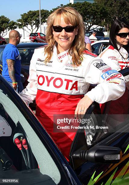 Actress Megyn Price poses for photographers during the press practice day for the Toyota Pro/Celebrity Race on April 6, 2010 in Long Beach,...