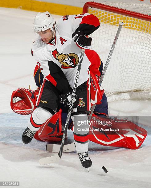 Mike Fisher of the Ottawa Senators attempts to tip the puck past Goaltender Tomas Vokoun of the Florida Panthers on April 6, 2010 at the BankAtlantic...