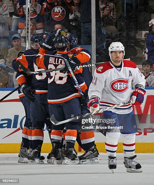 Blake Comeau of the New York Islanders scores at 12:29 of the first period against the Montreal Canadiens as Brian Gionta returns to the bench at...