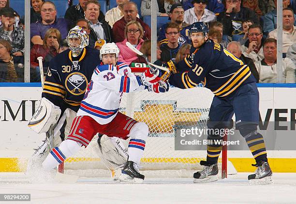 Henrik Tallinder of the Buffalo Sabres battles for position in front of the net with Chris Drury of the New York Rangers on April 6, 2010 at HSBC...